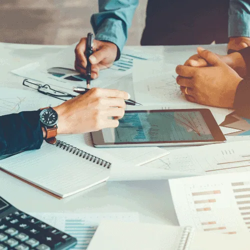 program-development Contractors using tablet and calculator for program development