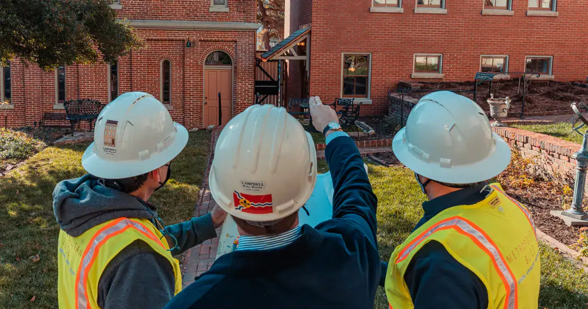 Metropolitan Build's Design-Build Construction team at a job site for a building renovation project