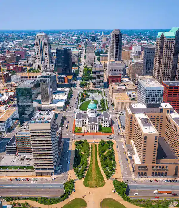 Aerial view of downtown city with Capitol building and surrounding skyscrapers.